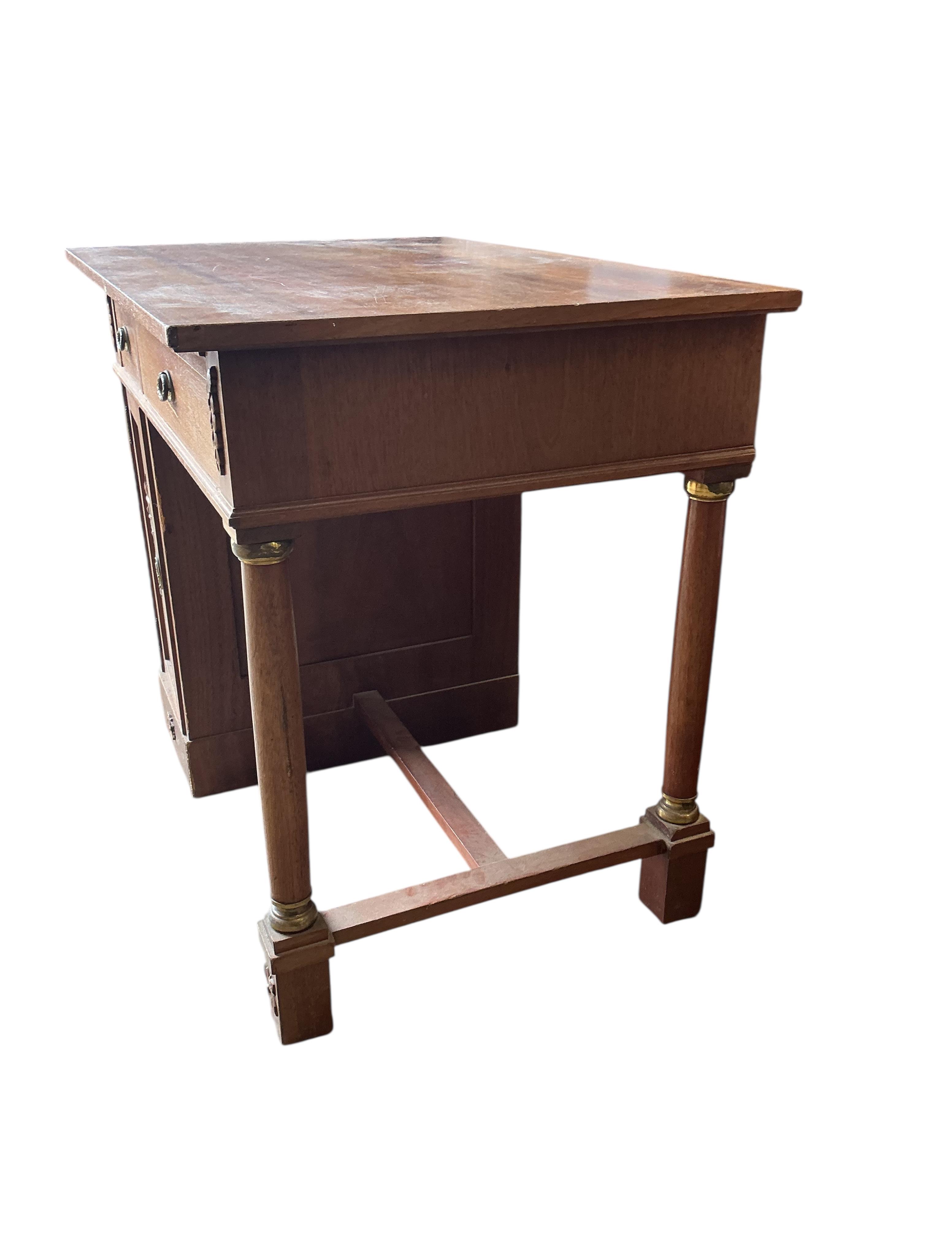 A French Empire style mahogany kneehole dressing table, width 90cm, depth 60cm, height 77cm